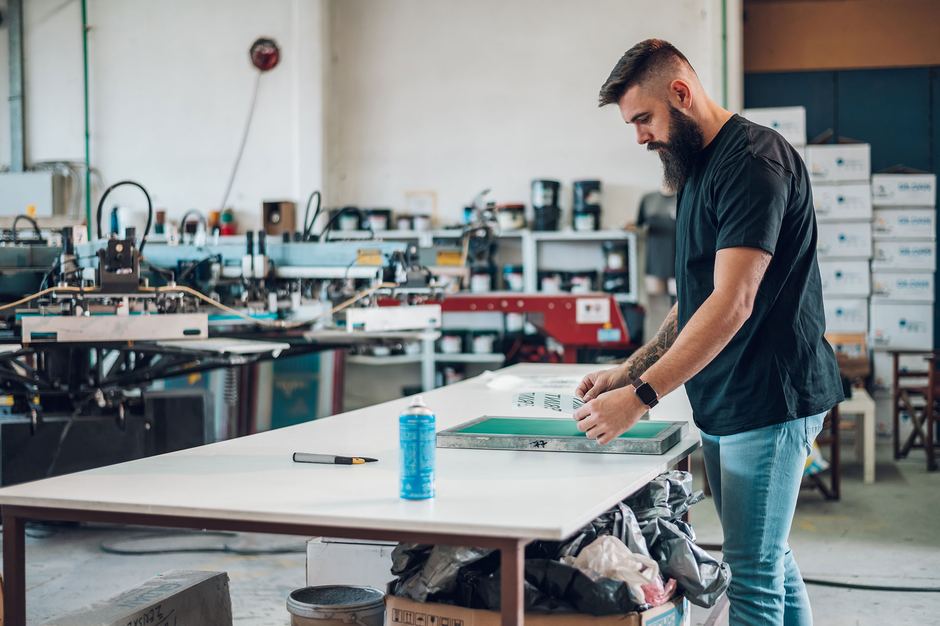 Custom screen printing services in Austin TX showing vibrant ink applied to t-shirts.