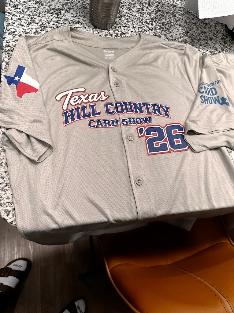 Heat press transferring dye sublimation graphics onto a polyester jersey in Austin.