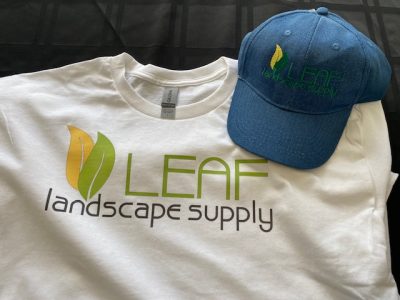 Custom screen printed company t-shirt and matching embroidered cap for Austin business