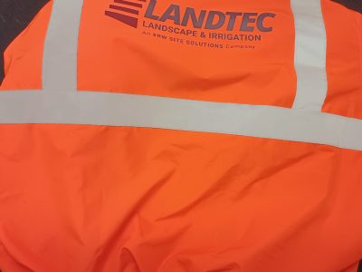 High-visibility safety jacket with custom printed corporate logo for Landtec